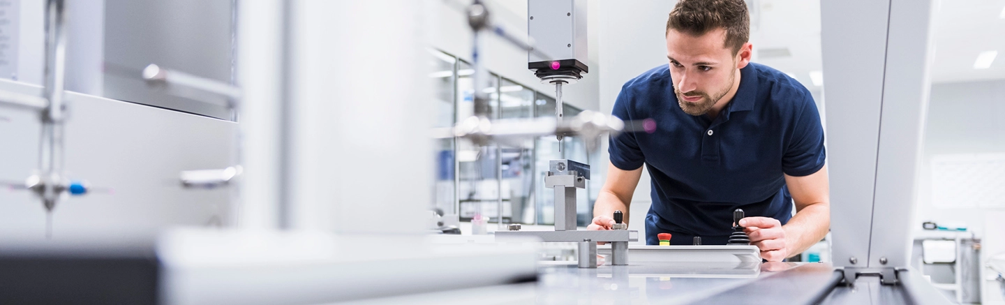 Man working with manufacturing machinery