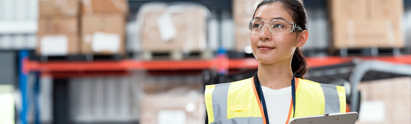 Woman wearing safety vest and glasses