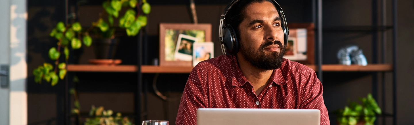 Man wearing headphones in office