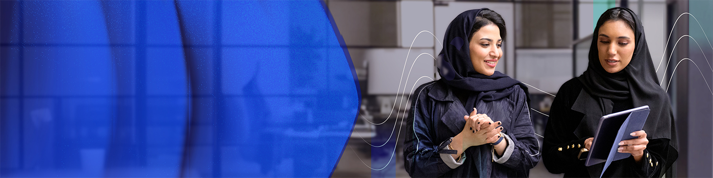 Two individuals wearing black abayas, one holding a tablet, standing in a modern office setting with abstract wave graphics in the background.